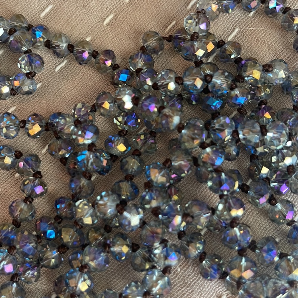 Smoky clear blue iridescent sparkly beaded necklace. 60 inches